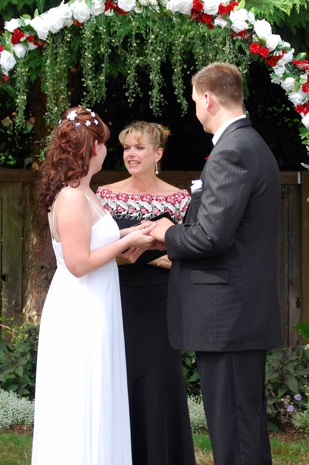 Outdoor ceremony by Radiant Touch Weddings in Milw