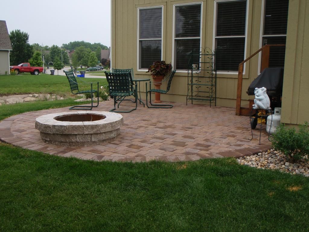 Patio, firepit, and plantings