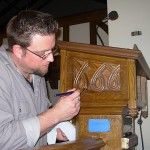 Applying shellac at Fort Snelling Chapel