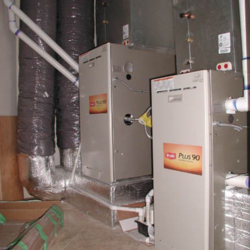 Newly installed side by side up flow gas furnaces 