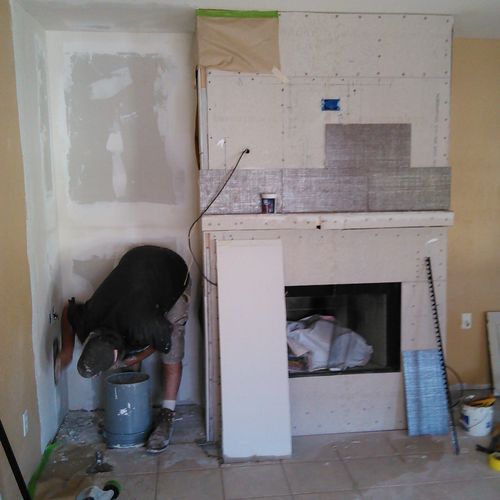 Cubbie wall demolition with fireplace chase build-