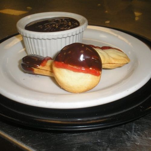 Shortbread cookies filled with jam and dipped in g