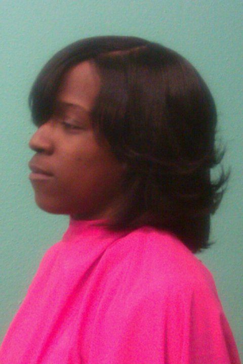 Relaxed hair w/ feathered look
