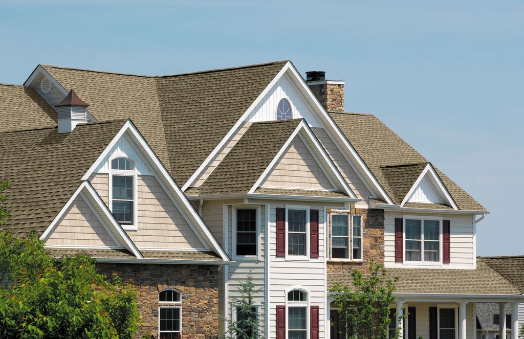Lifetime shingle roofs with transferable, lifetime