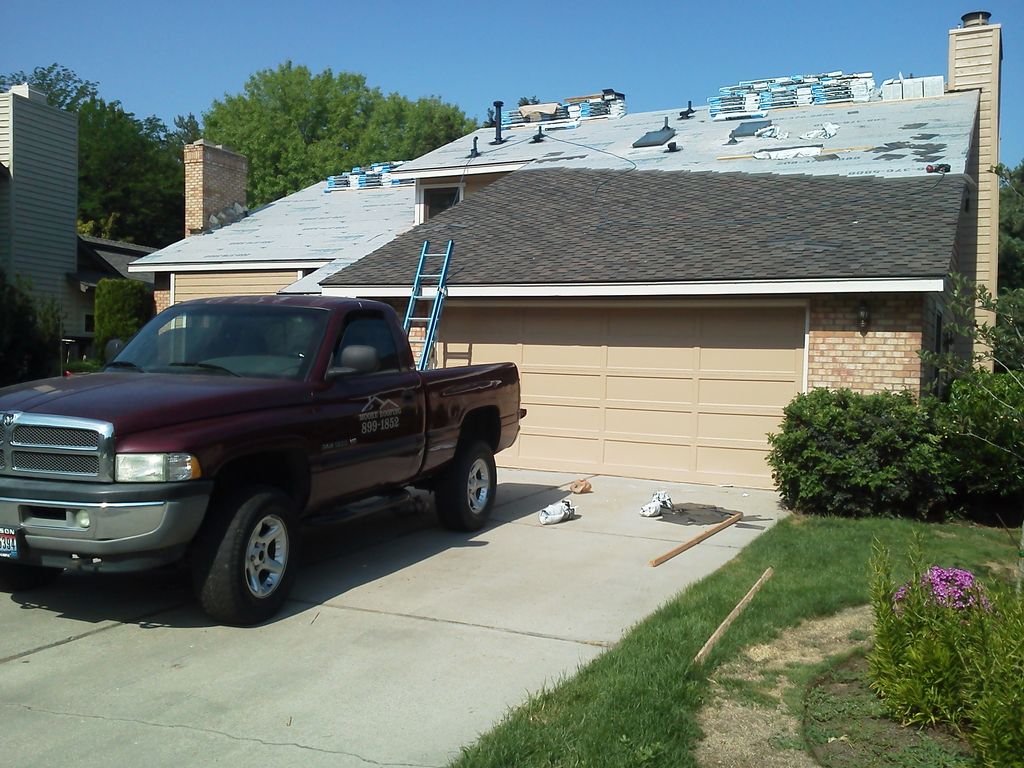 laying Presidential Life Time Roof.