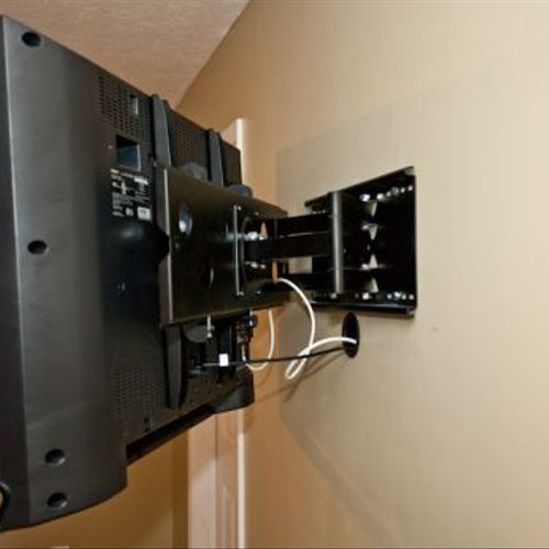 TV wall mount, with wires run behind wall.  For a 