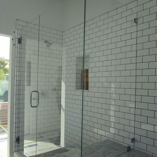 Three panel shower enclosure with a bench seat for
