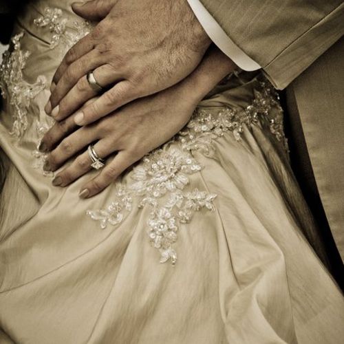 The Rings, detail on the dress, and the embrace of