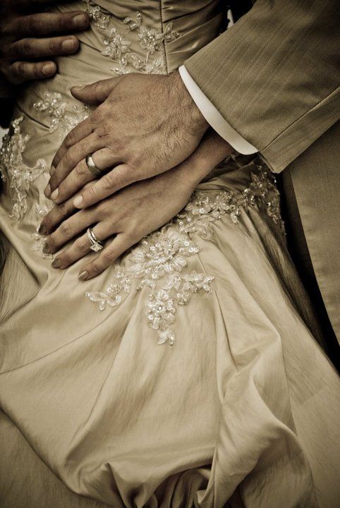 The Rings, detail on the dress, and the embrace of