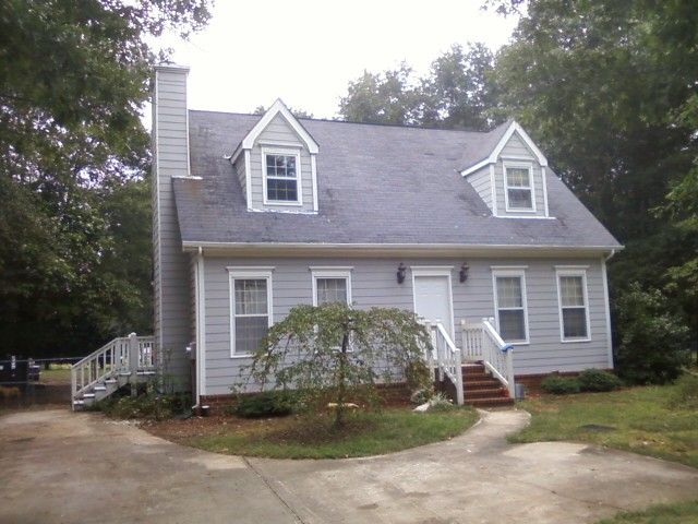 Exterior paint job on new siding and new dormers