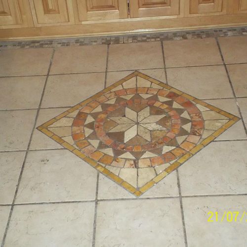 did is tile floor with a center pic.