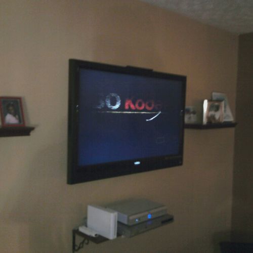 42"TV with articulating mount and custom shelving.