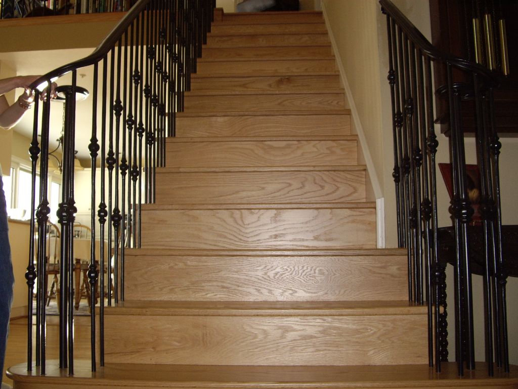 Solid oak stairs and bronze railings.