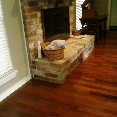 Install of wood floor at fireplace (Fireplace has 