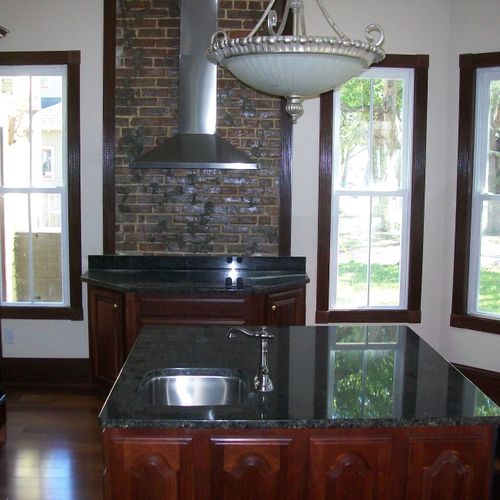 Full functioning kitchen with granite countertops.