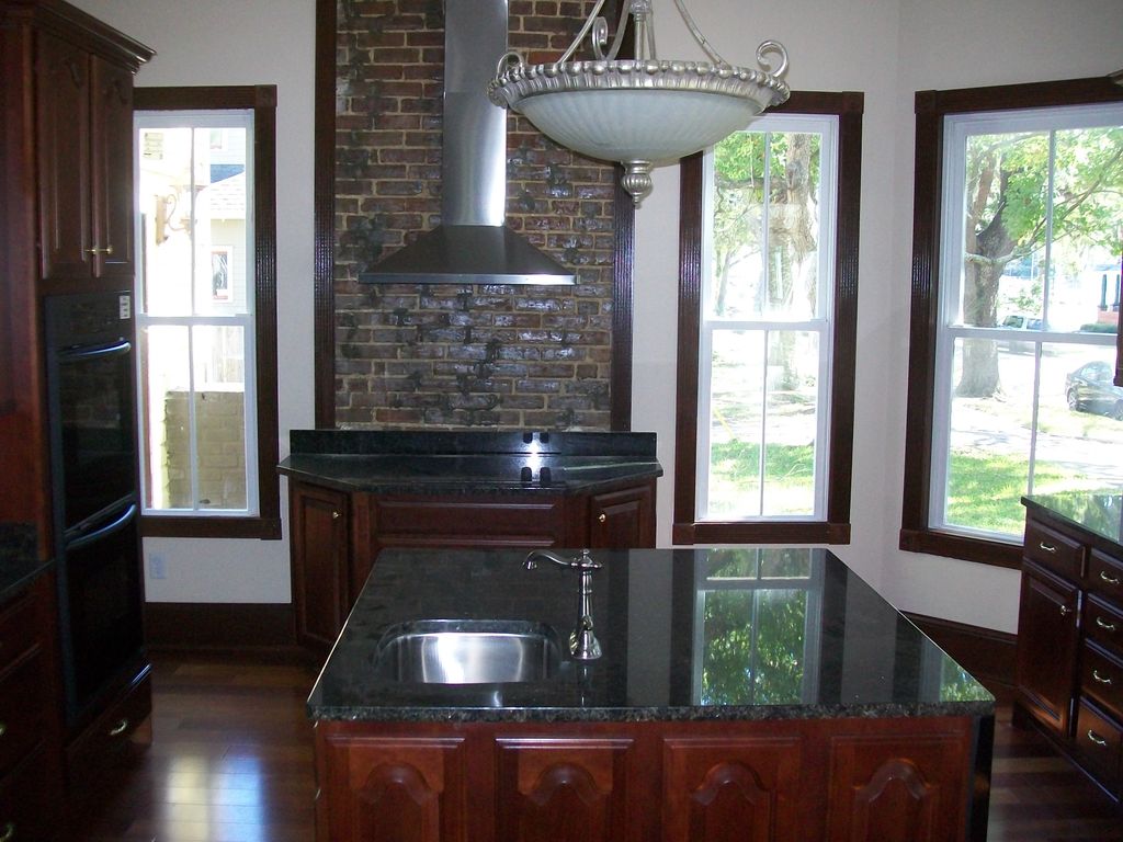 Full functioning kitchen with granite countertops.