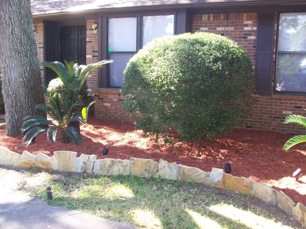 Flagstone landscaping and red mulch. Newly painted