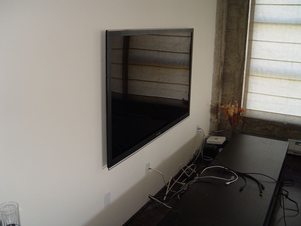 52 in. flat screen mounted and cables through wall