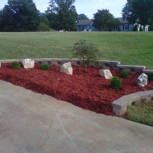 retaining wall out of castleblock, red mulch coupl