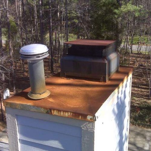 Rusted chimney top before replacement