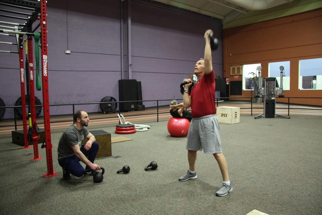 Practicing kettlebell complexes.