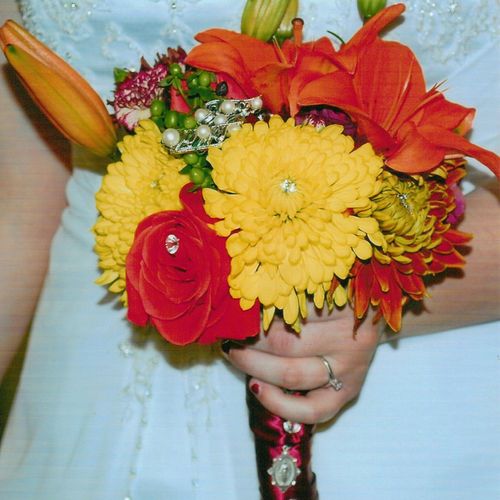 Fall bridal bouquet accented with brooches, pendan