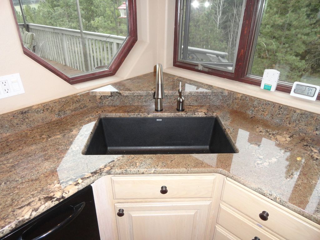 Corner sink with a granite shelf