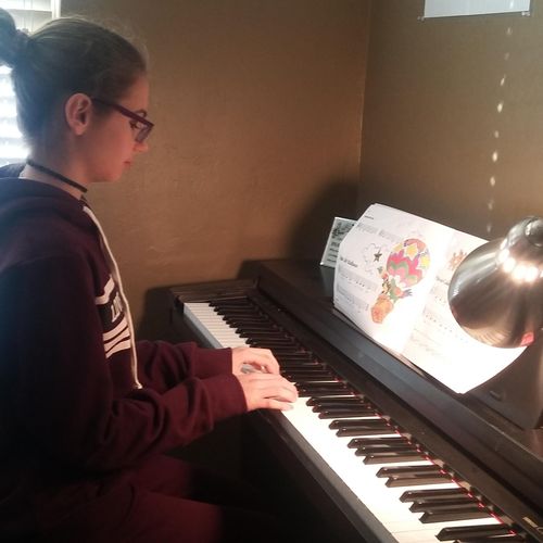 This young lady is building her music piano skills