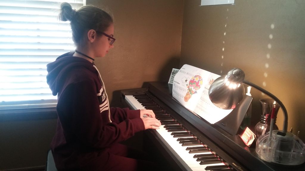 This young lady is building her music piano skills