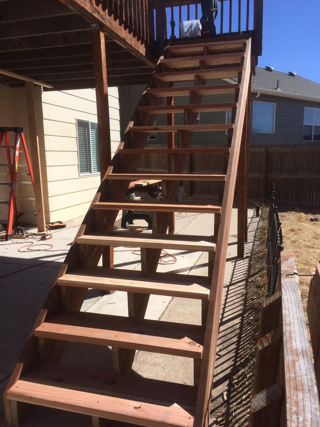 New pressure treated stringers and redwood stair t