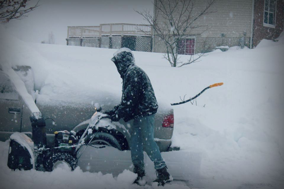 Team member Josh plowing snow
