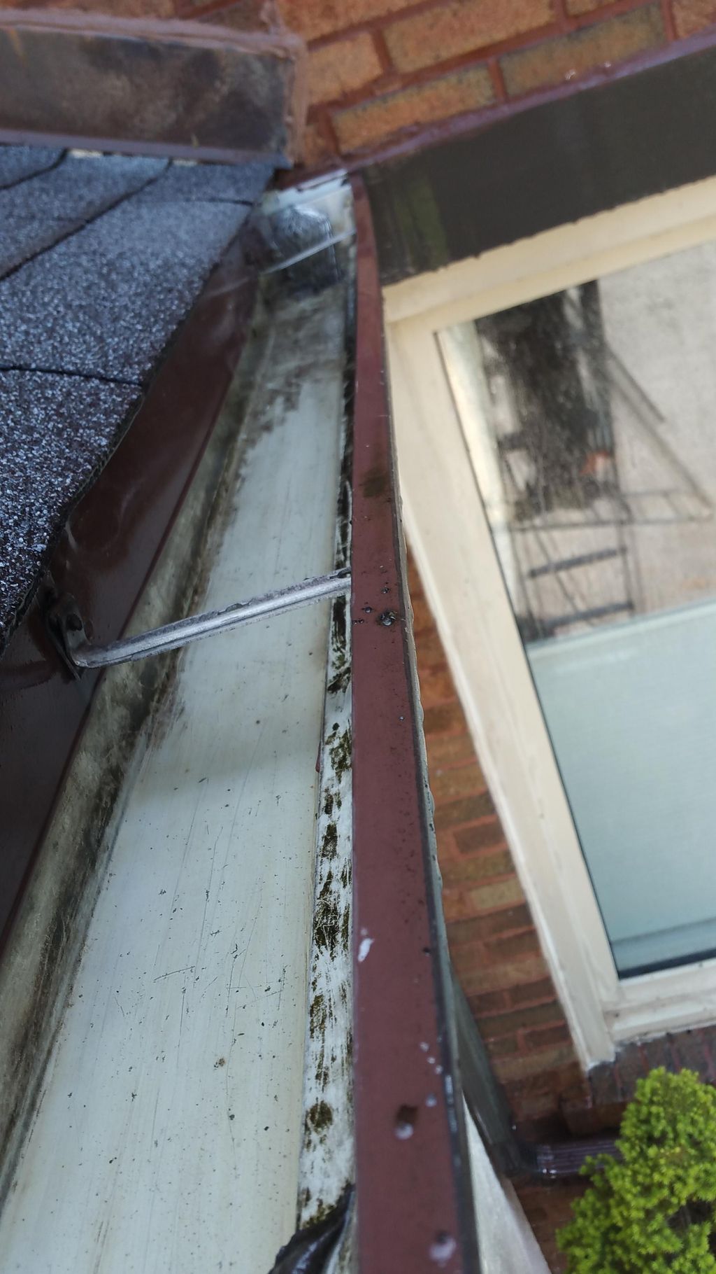 Gutter and downspout free of debris (AFTER)