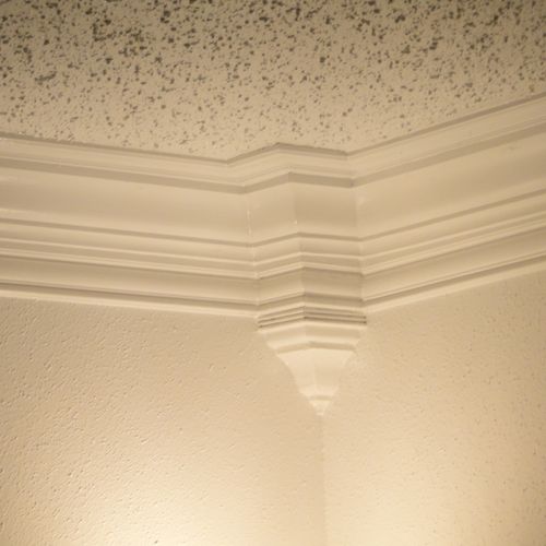 Close up of three step crown molding and popcorn c