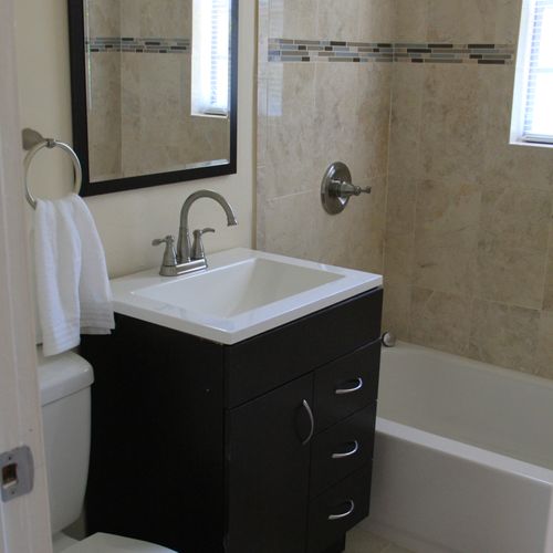 Remodeled Bathroom:
New tile, tub, vanity, vanity 