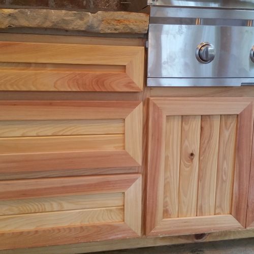 Cypress cabinetry for outdoor kitchen.