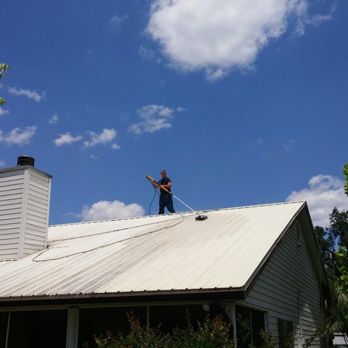 Cleaning a metal roof.  About 40 foot in the air!