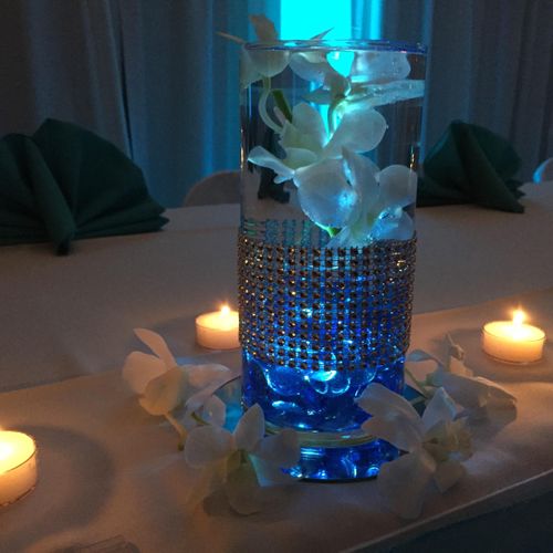 Custom orchid, diamond-wrapped centerpieces by Mx2