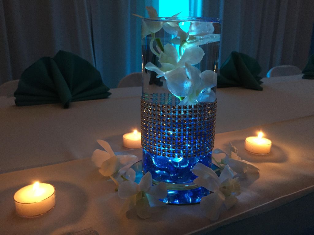 Custom orchid, diamond-wrapped centerpieces by Mx2