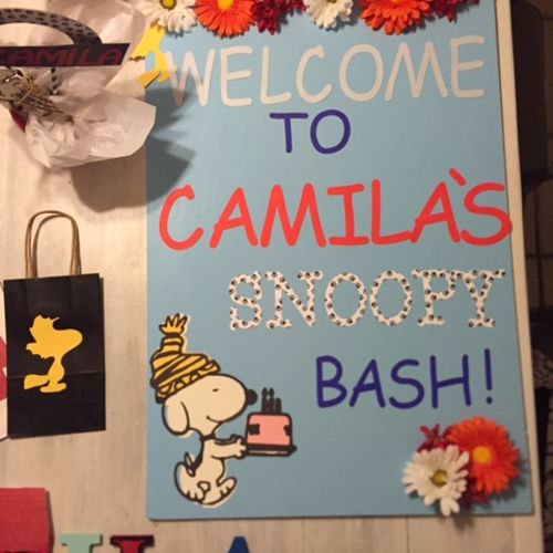 Snoopy themed goodie bags and welcome board