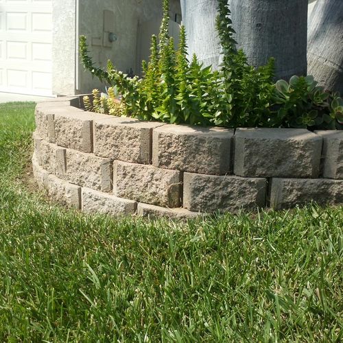 Installed a mini planter retainer with paver block
