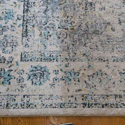 Area Rug Cleaning - Before on the right - in progr