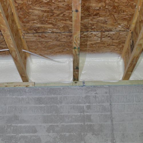 Rim joist insulation with spray foam