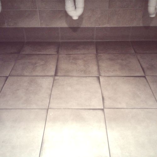 Dirty tile and grout.