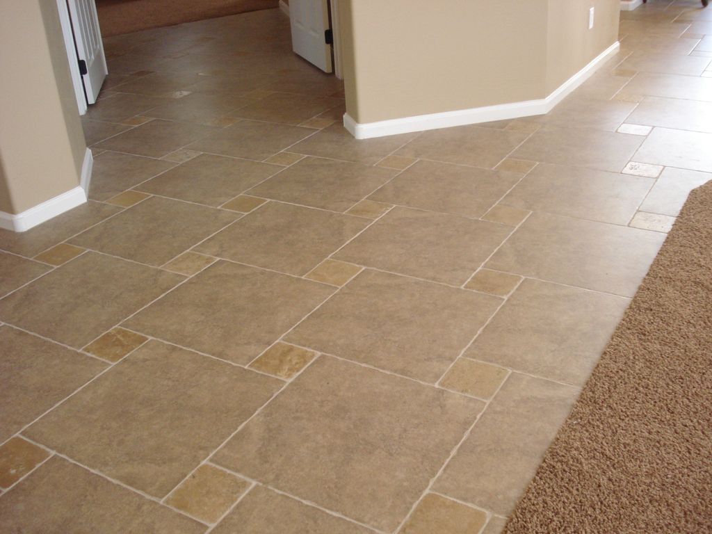 20" tile with 6x6 tumbled stone installed with a 1