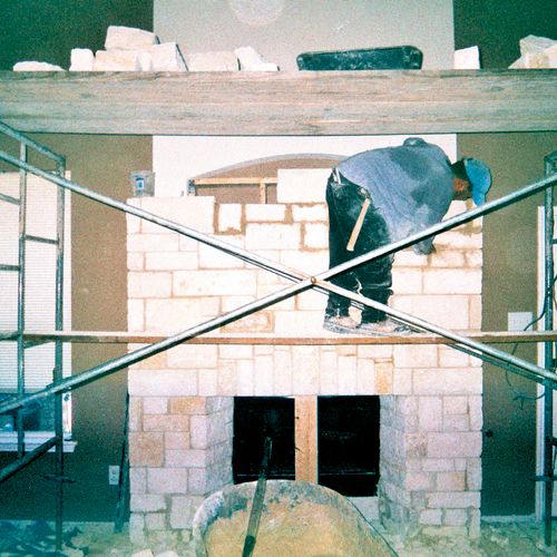 The building of an indoor fireplace remodel using 