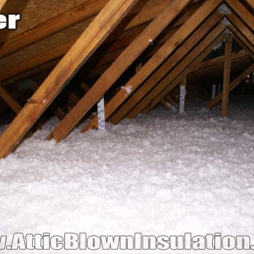 Attic insulation after blown fiberglass has been i