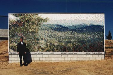 Roy Rendahl in front of his highway mural in Fresn