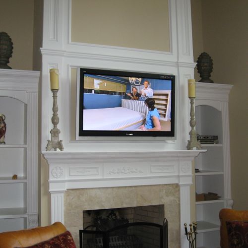 Plasma TV above Fireplace