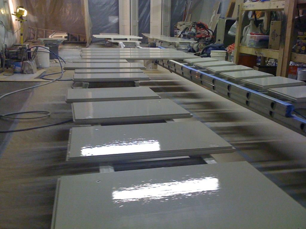 Painting cabinet doors at the shop.