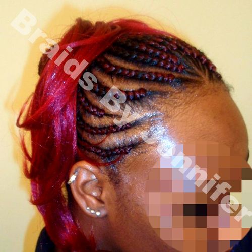 Red hair braided in up into a ponytail